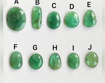 May include: Ten emerald green gemstones of various shapes and sizes, labeled A through J.
