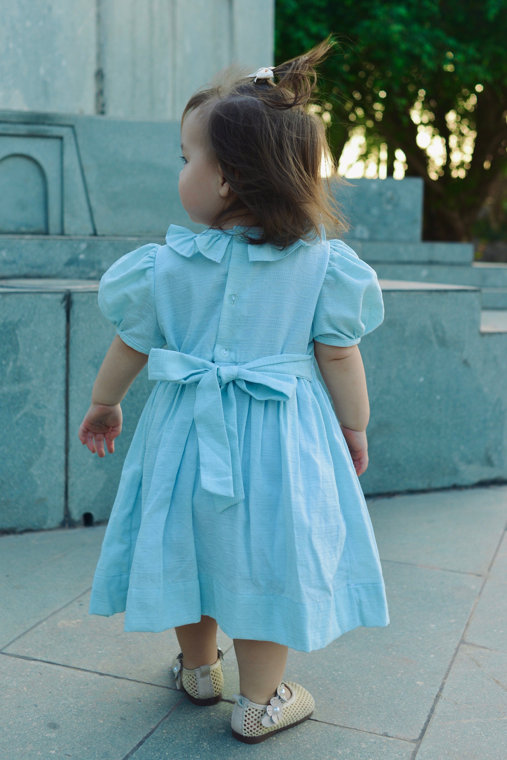 Petit Bebe Girls Blue Liberty Floral Smocked Long Sleeved Dress main image 0