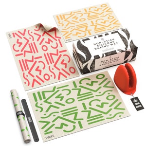 May include: Three non-stick silicone baking mats with geometric patterns in red, green, and yellow. The mats are packaged in a box with the text "Non-stick Silicone Baking Mat". A red silicone oven mitt is also included.
