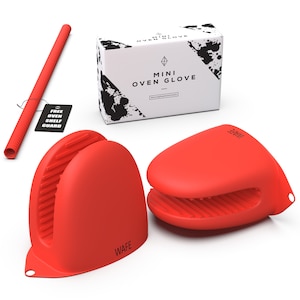 May include: Two red silicone oven mitts with a black "WAFE" logo on each mitt. The mitts are on a white surface. A white box with black text reads "MINI OVEN GLOVE #simplifieverything". A red and white striped oven shelf guard is included.
