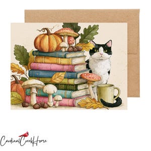 May include: A greeting card featuring a watercolor illustration of a black and white cat sitting next to a stack of colorful books, pumpkins, mushrooms, acorns, and oak leaves. A yellow mug sits beside the cat, and a brown envelope is included.
