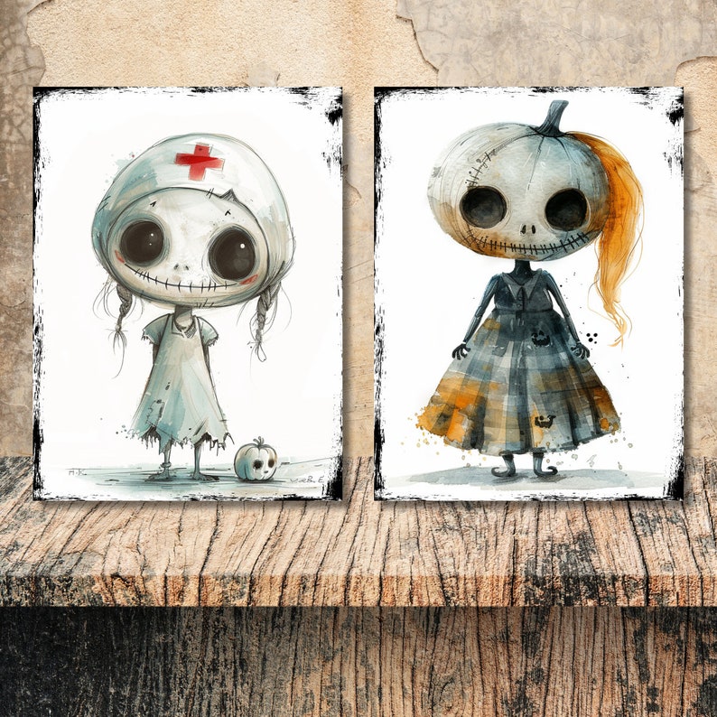 May include: Two rectangular wall art prints featuring stylized characters with large round heads and stitched mouths. The left print shows a nurse character with a red cross cap. The right print shows a pumpkin-headed character in a plaid dress.