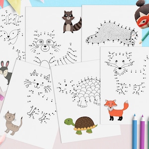 Puede incluir: Un conjunto de hojas de actividades de punto a punto imprimibles con varios animales, incluyendo un zorro, un mapache, un gato, una tortuga, un conejo y un erizo. Las hojas están diseñadas para que los niños conecten los puntos y revelen las imágenes ocultas.