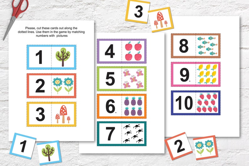 May include: A set of 10 colourful cards with numbers 1 through 10 and corresponding pictures. The cards are designed for a matching game to help children learn to count.