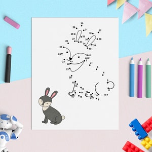 May include: A black and white connect-the-dots activity sheet featuring a rabbit. The numbers 1 through 42 are scattered around the page, with dots at each number. The rabbit is drawn in a simple cartoon style.