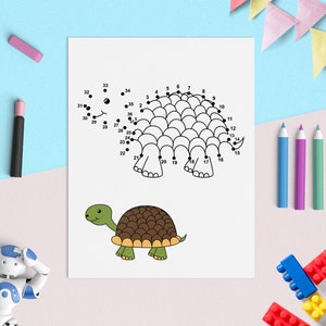 May include: A black and white connect-the-dots activity sheet featuring a turtle. The numbers 1 through 36 are printed around the outline of the turtle. A completed drawing of a turtle is shown below the connect-the-dots activity.
