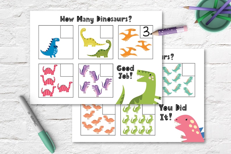 May include: A printable worksheet with colourful dinosaur illustrations. The worksheet asks "How Many Dinosaurs?" and has boxes for counting the dinosaurs. The worksheet includes the text "Good Job!" and "You Did It!"