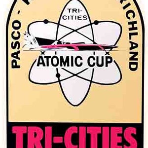 May include: A yellow and black circular logo with the text "Pasco - Kennewick - Richland" around the outside. The logo features a stylized atom with the text "Tri-Cities" and "Atomic Cup" inside. The bottom of the logo has the text "Tri-Cities Washington" in black with a red outline.