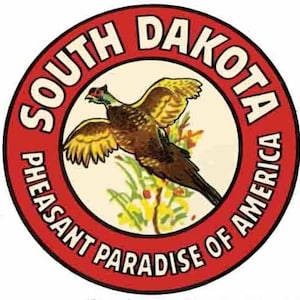 May include: A red circle with the words "South Dakota Pheasant Paradise of America" around the edge. Inside the circle is a yellow and brown pheasant with its wings spread.