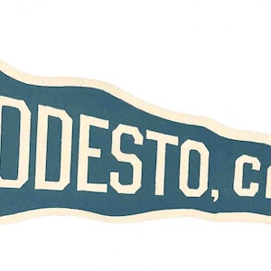 May include: A blue pennant with white text that reads "MODESTO, CA."