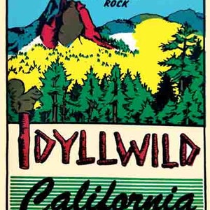 May include: A vintage travel sticker with a green, yellow, and blue illustration of a mountain range with a red rock formation. The text "Tanquitz Rock" is at the top of the sticker. The text "Idyllwild California" is at the bottom of the sticker.