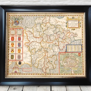 May include: An antique map of Devonshire, England, with the title "Devonshire with Exeter, Exmouth, and the names of such places as have borne the title of Baron."