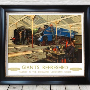 May include: Framed vintage print titled "Giants Refreshed" depicting steam locomotives in a workshop. The print shows workers attending to the locomotives, one black and one blue, with the text "British Railways" at the bottom.