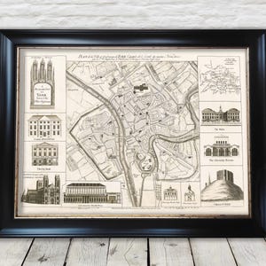 May include: A vintage black and white map of York, England, with the title "Plan de la Ville et de la Forteresse de York, Capitale du Comté de York, Nommée Eboracum". The map shows the city's streets, buildings, and landmarks, including the City Walls, the Minster, and the Ouse River. The map is framed in a black frame.