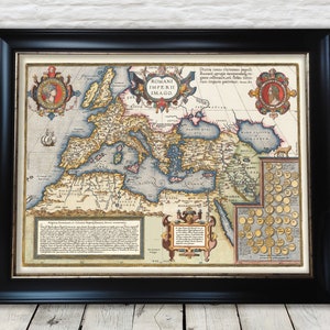 May include: An antique map of the Roman Empire, "ROMANI IMPERII IMAGO", with detailed borders and text in Latin. The map is framed in a black frame and has a white background.