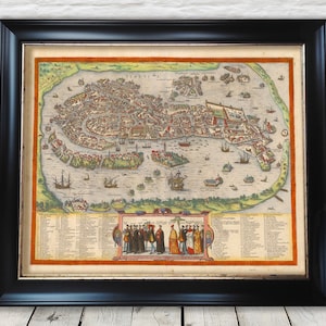 May include: An antique map of Venice, Italy, printed in black, brown, red, and yellow ink on a cream-colored paper. The map shows the city's canals, islands, and buildings. The map is framed in a black frame.