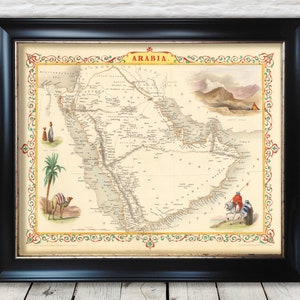 May include: An antique map of Arabia with a decorative border. The map is printed on paper and has a cream background with brown lines and text. The map shows the location of cities, mountains, and rivers. The map is framed in a black frame.