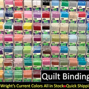 May include: A wall of colorful double-fold quilt binding in various colors. The binding is packaged in clear plastic and labeled with numbers. The text at the bottom of the image reads "Quilt Bindings" and "All Wright's Current Colors All in Stock Quick Shipping!"