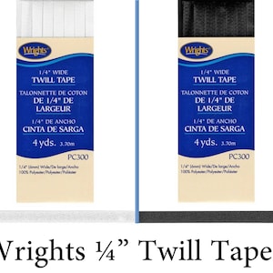 May include: Two rolls of 1/4 inch wide white and black twill tape. Each roll is labeled "Wrights 1/4" WIDE TWILL TAPE" and includes the text "TALONNETTE DE COTON DE 1/4" DE LARGEUR 1/4" DE ANCHO CINTA DE SARGA 4 yds. 3.70m PC300 1/4" (6mm) Wide/De large/Ancho 100% Polyester/Polyester/Poliéster".
