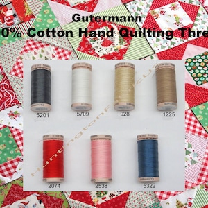 May include: A collection of ten spools of Gutermann 100% cotton hand quilting thread. The spools are arranged in two rows of five. The thread colors are black, white, beige, brown, red, pink, and blue.