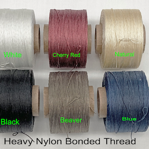 May include: Six spools of heavy nylon bonded thread in the colors white, cherry red, natural, black, beaver, and blue.  Heavy Nylon Bonded Thread.
