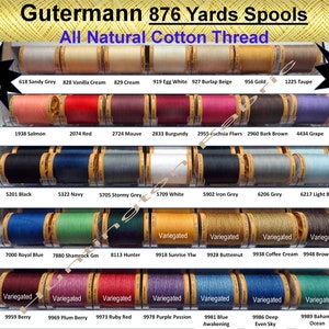 May include: A selection of Gutermann 802-metre spools of all-natural cotton thread. The image displays a range of colours, such as Sandy Grey, Vanilla Cream, and Royal Blue. The text "Best Quilting Thread" is visible.