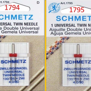May include: Two packages of Schmetz universal twin needles. Each package has a white and red plastic case with two needles. The packaging includes the text "SCHMETZ", "1 UNIVERSAL TWIN NEEDLE", and needle size information.