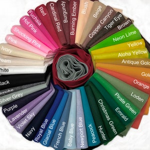 May include: A color chart of felt fabric swatches in a variety of colors, including red, pink, blue, green, yellow, orange, brown, and gray. The swatches are arranged in a circle, with the names of the colors printed on each swatch.