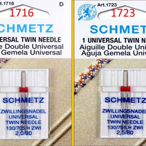 May include: Two packages of Schmetz universal twin needles. Each package has a clear plastic case with a red and silver needle. The text on the packages includes "1 Universal Twin Needle" and "130/705 H ZWI".