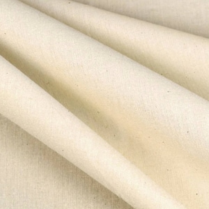 May include: A close-up of a plain, off-white fabric with a slightly textured surface.
