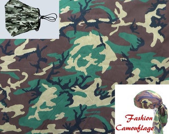 May include: A green, brown, and black camouflage fabric with a matching bandana tied around a head. The bandana has a knot at the back of the head and the ends are hanging down. The text "Fashion Camouflage" is written below the bandana.