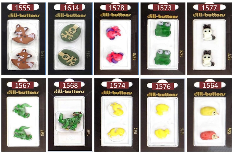 May include: Assortment of colorful plastic buttons with various animal designs, including a fox, reindeer, dinosaur, frog, and a cat. The buttons are packaged in clear plastic containers with the product number and brand name "dill-buttons" printed on the front.