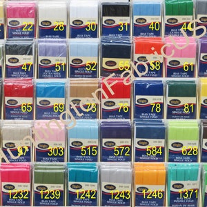 May include: A collection of bias tape in various colors and widths, labeled with numbers and descriptions. The tape is packaged in clear plastic bags with a white label.