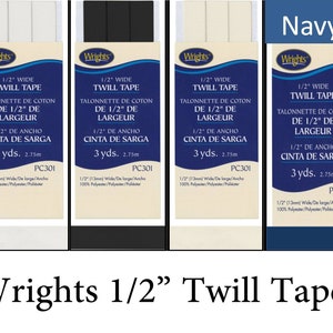 May include: Four spools of 1/2 inch wide twill tape in white, black, beige, and navy blue. Each spool is labeled "Wrights 1/2" Wide Twill Tape" and includes details in English, French, and Spanish. The spools are labeled with the product number PC301.