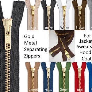 May include: A variety of gold metal separating zippers in different colors, including beige, black, white, brown, grey, camel, navy, green, red, and royal. The zippers are labeled with their colors and are suitable for jackets, sweatshirts, hoodies, and coats. The text "Gold Metal Separating Zippers" and "For Jackets Sweatshirts Hoodies Coats" is also visible in the image.