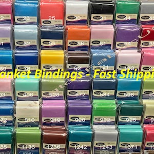 May include: A variety of colors of satin blanket binding, labeled with numbers and the word "Weights". The text "Blanket Bindings - Fast Shipping" is at the bottom of the image.