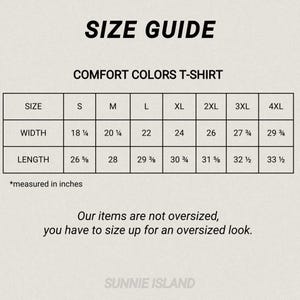 May include: A size guide for Comfort Colors T-shirts, with measurements in inches. The guide includes sizes S to 4XL, detailing width and length. The text advises sizing up for an oversized fit. The brand name is Sunnie Island.