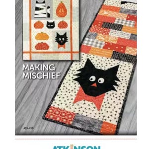 May include: A Halloween-themed quilt pattern with a black cat, pumpkins, and the text "MAKING MISCHIEF." The pattern includes a table runner and a smaller quilt block, featuring orange, black, and white fabrics. The Atkinson Designs logo is at the bottom.