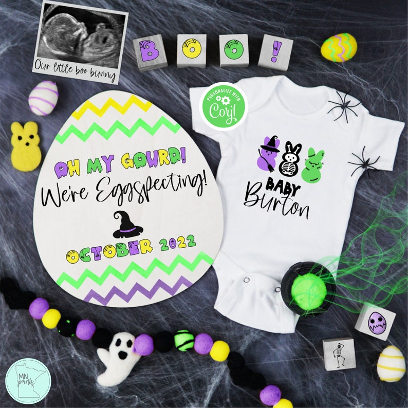 May include: A Halloween-themed baby announcement with a purple, green, and yellow egg-shaped sign that reads "Oh my gourd! We're Eggspecting! October 2022". A white onesie with a purple, green, and white ghost, a skeleton, and a green bunny with the text "Baby Burton" is next to the sign.
