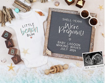 May include: A pregnancy announcement with a white onesie that says "Little Beach Bum" and a chalkboard sign that says "Shell-Yeah! We're Pregnant! Baby Lagoon Making Waves July 2024". There is a sonogram image and beach-themed decorations.