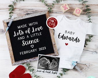 May include: A white onesie with the text "BABY Edwards" and a red heart. A letter board with the text "MADE WITH Lots of Love AND A LITTLE Science FEBRUARY 2023". A black and white ultrasound image with the text "Love at first Sight".