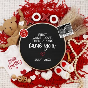May include: A black chalkboard sign with the text "First came love, then along came you" and the date "July 20XX". The sign is surrounded by red and white hearts, a teddy bear, a baby onesie, a wooden rattle, and a small ultrasound image with the text "Love at first sight".