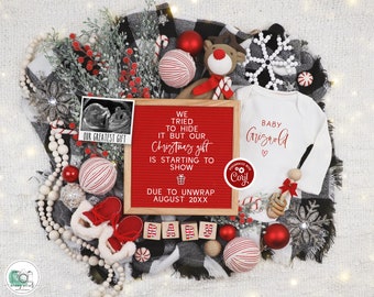May include: A red letter board with the text "We tried to hide it but our Christmas gift is starting to show due to unwrap August 20XX".  The board is surrounded by Christmas decorations, including a white onesie with the text "Baby Griswold" and a red and white candy cane.
