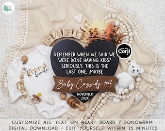May include: A black heart-shaped chalkboard with the text "Remember when we said we were done having kids? Seriously, this is the last one...maybe" and "Baby Cassidy #4 November 202X". The chalkboard is surrounded by wooden blocks spelling "BABY", a white crocheted teddy bear, and a white onesie with gold text that says "The Grand Finale".