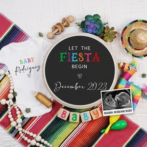 May include: A white onesie with the text "BABY Rodriguez" in rainbow colors. A black chalkboard with the text "LET THE FIESTA BEGIN December 2023" in white. A wooden block with the word "BABY" in colorful letters. A black and white ultrasound image with the text "NACHO AVERAGE BABY".