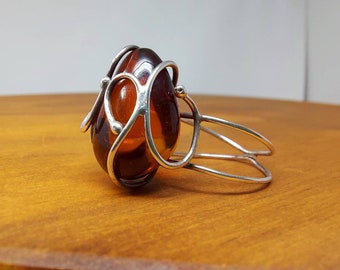 Minimalist sterling silver wire ring with dark cherry amber