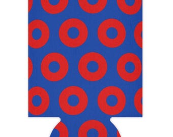 May include: A blue foam beverage insulator featuring a repeating pattern of solid red circles. The cylindrical sleeve has a flat base and an open top, designed to hold a standard beverage container with a consistent, vibrant color scheme.
