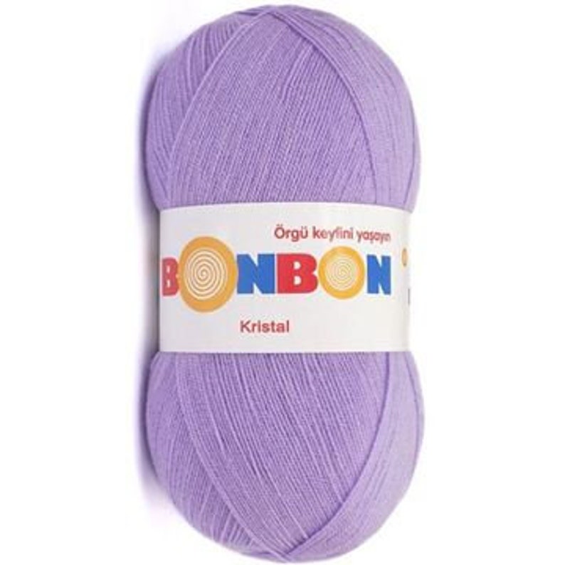 May include: A skein of light purple yarn labeled "Bonbon Kristal" with the text "&Ouml;rg&uuml; keyfini yaşayın" on the label.