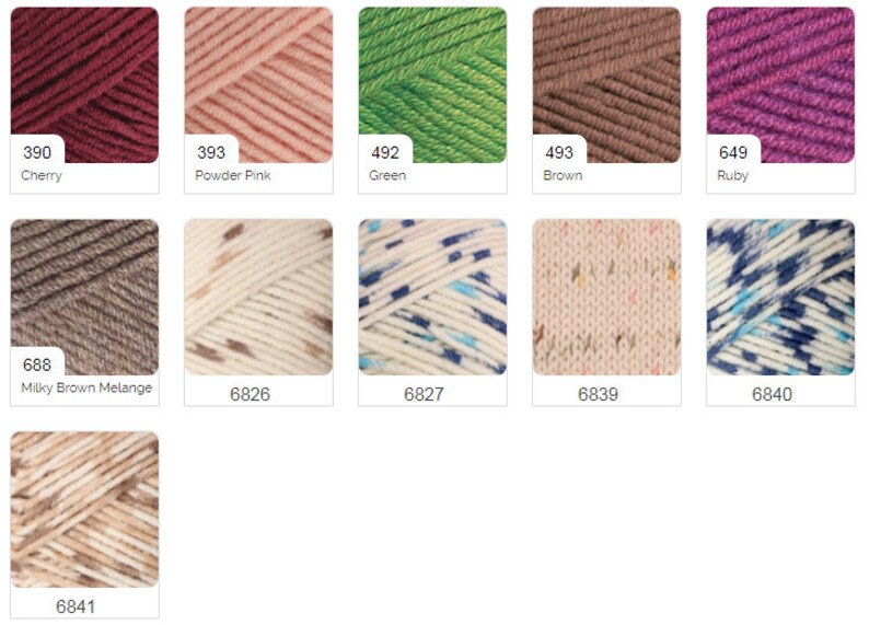 Puede incluir: Una colecci&oacute;n de ovillos de lana en varios colores y patrones, incluyendo cereza, rosa en polvo, verde, marr&oacute;n, rub&iacute;, marr&oacute;n lechoso jaspeado, beige con motas marrones, blanco con motas azules y beige, beige con motas rosas y blanco con motas azules.