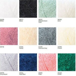 May include: A color chart of yarn samples in various colors, including white, black, almond green, ecru, honey, charcoal grey, cream, grey mauve, navy blue, pink, and green.
